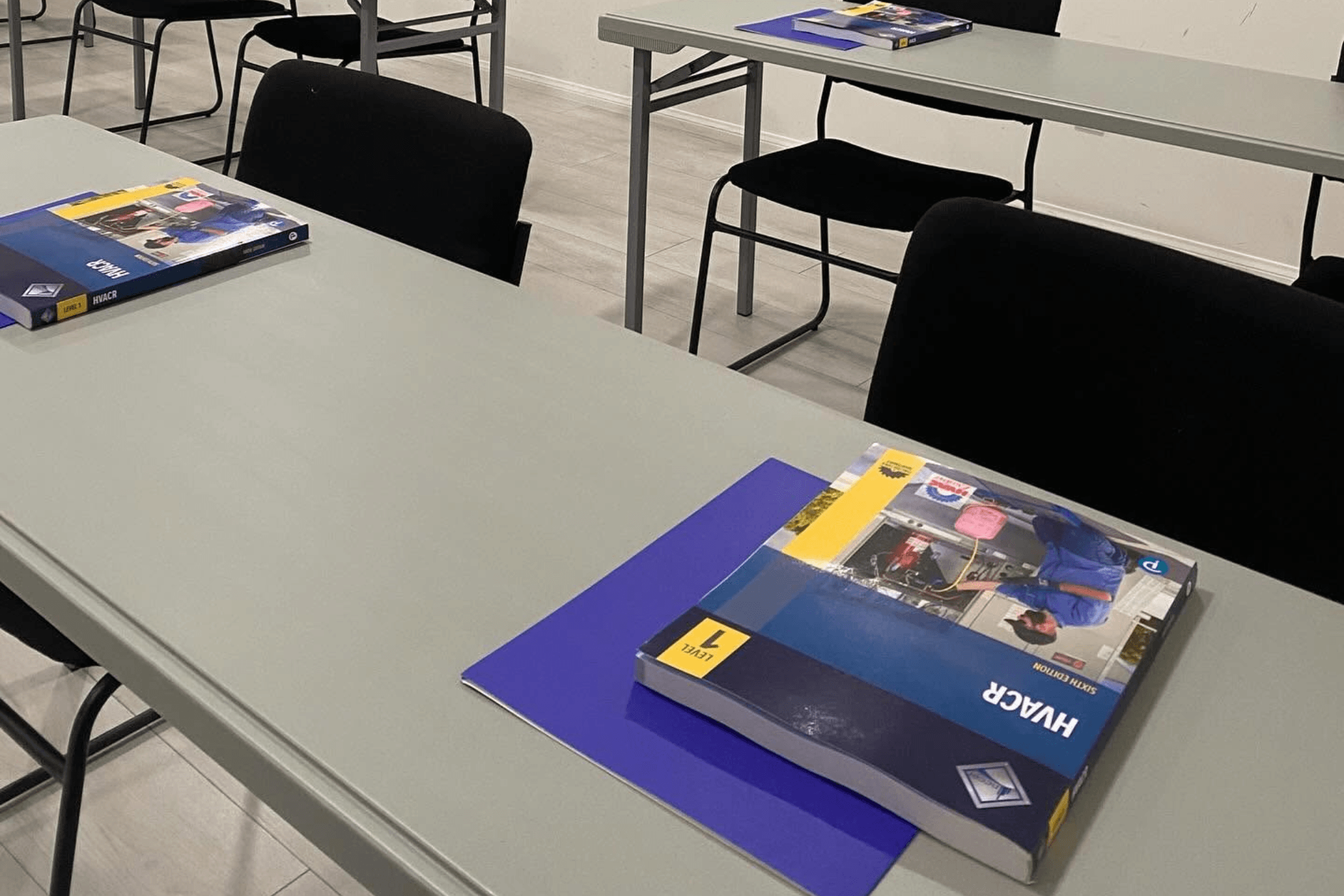 HVAC students in a classroom setting learning system theory at PHCC Academy of San Diego