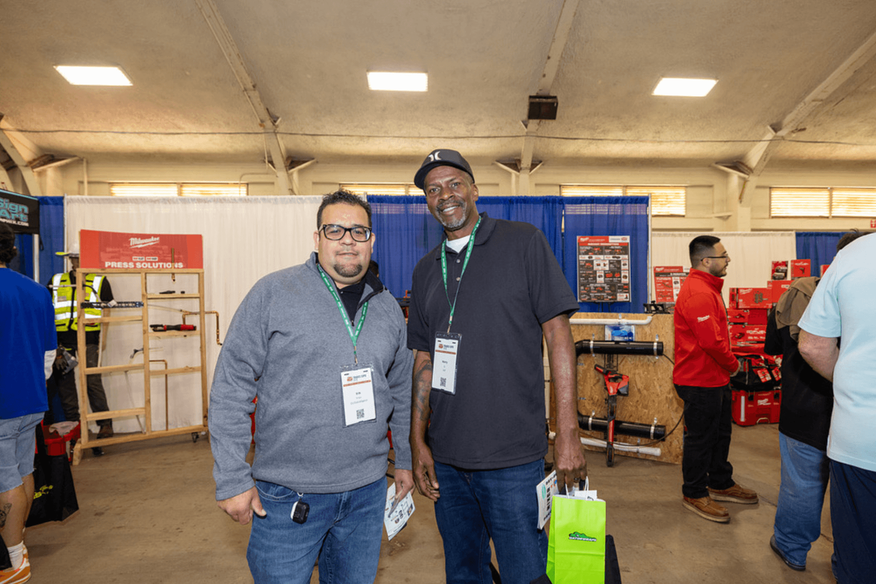 Plumbing professionals at the Milwaukee exhibit booth at the Trades Expo